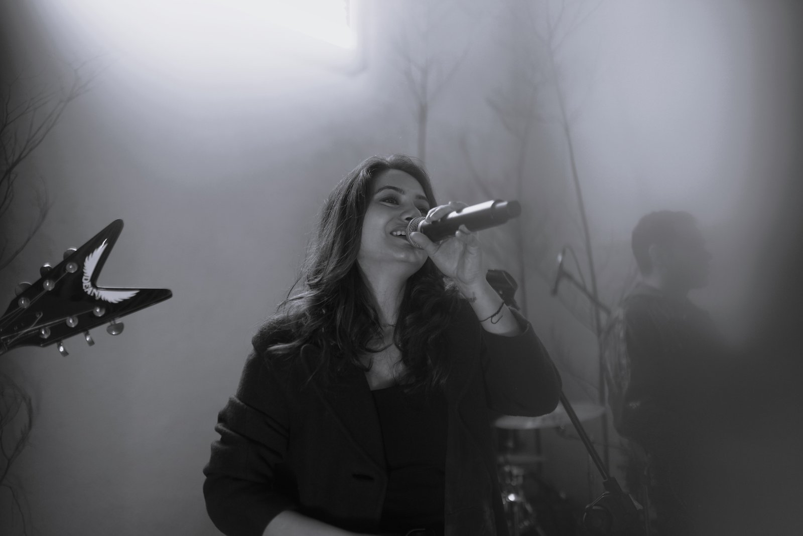 Chhavi Pradhan singing with microphone
