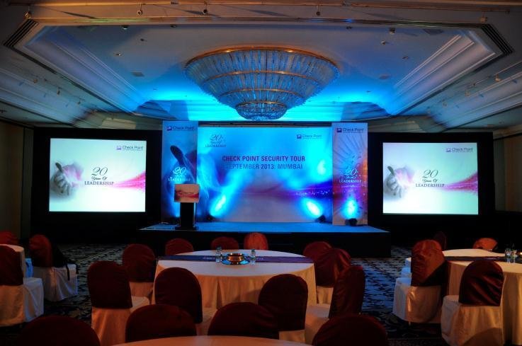 Corporate event AV setup with projection screens